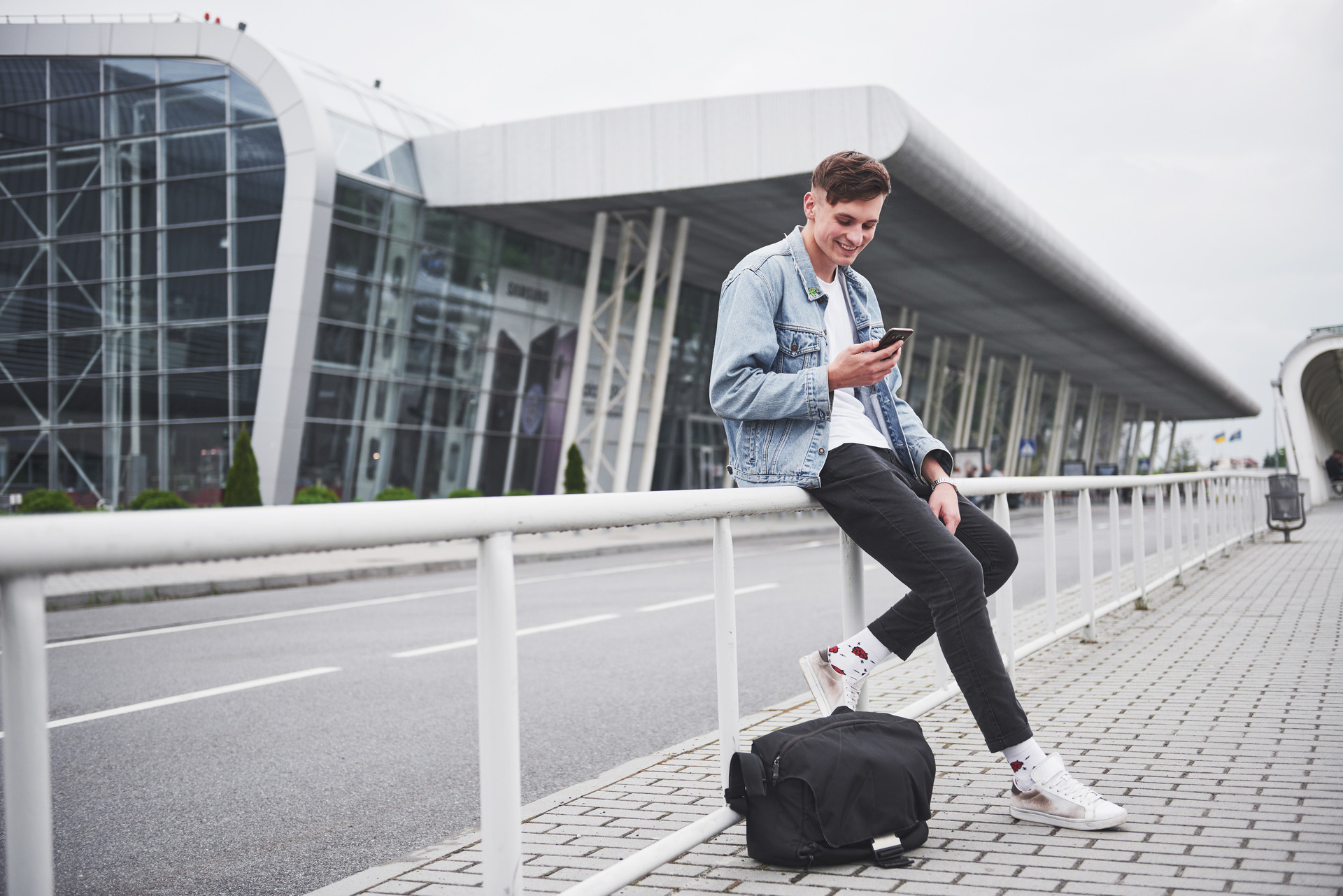 handsome-young-man-talking-phone-near-office-space (1)